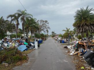 Debris from Hurricane Helene lines a street in the Redington Beach section of St. Petersburg, Florida ahead of Hurricane Milton’s expected landfall.